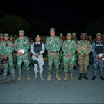 Formation of Dominican military in camouflage uniform next to the Director General DGM in rows, in front of the entrance of the “11er. BON. GPF. ERD.