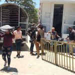 Undocumented immigrants getting off the truck to enter the border crossing.