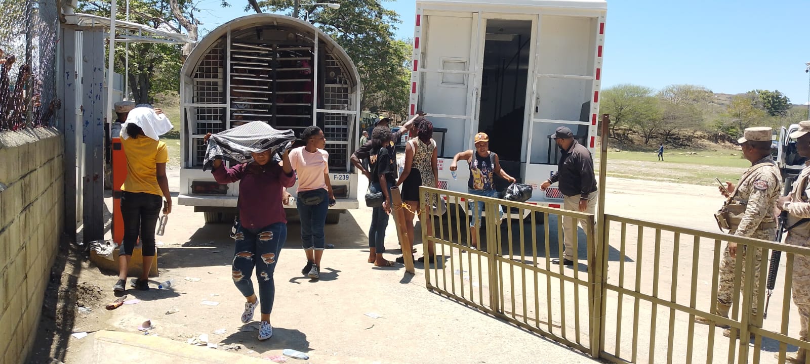 Undocumented immigrants getting off the truck to enter the border crossing.