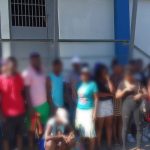 Undocumented foreigners in front of a reception center.