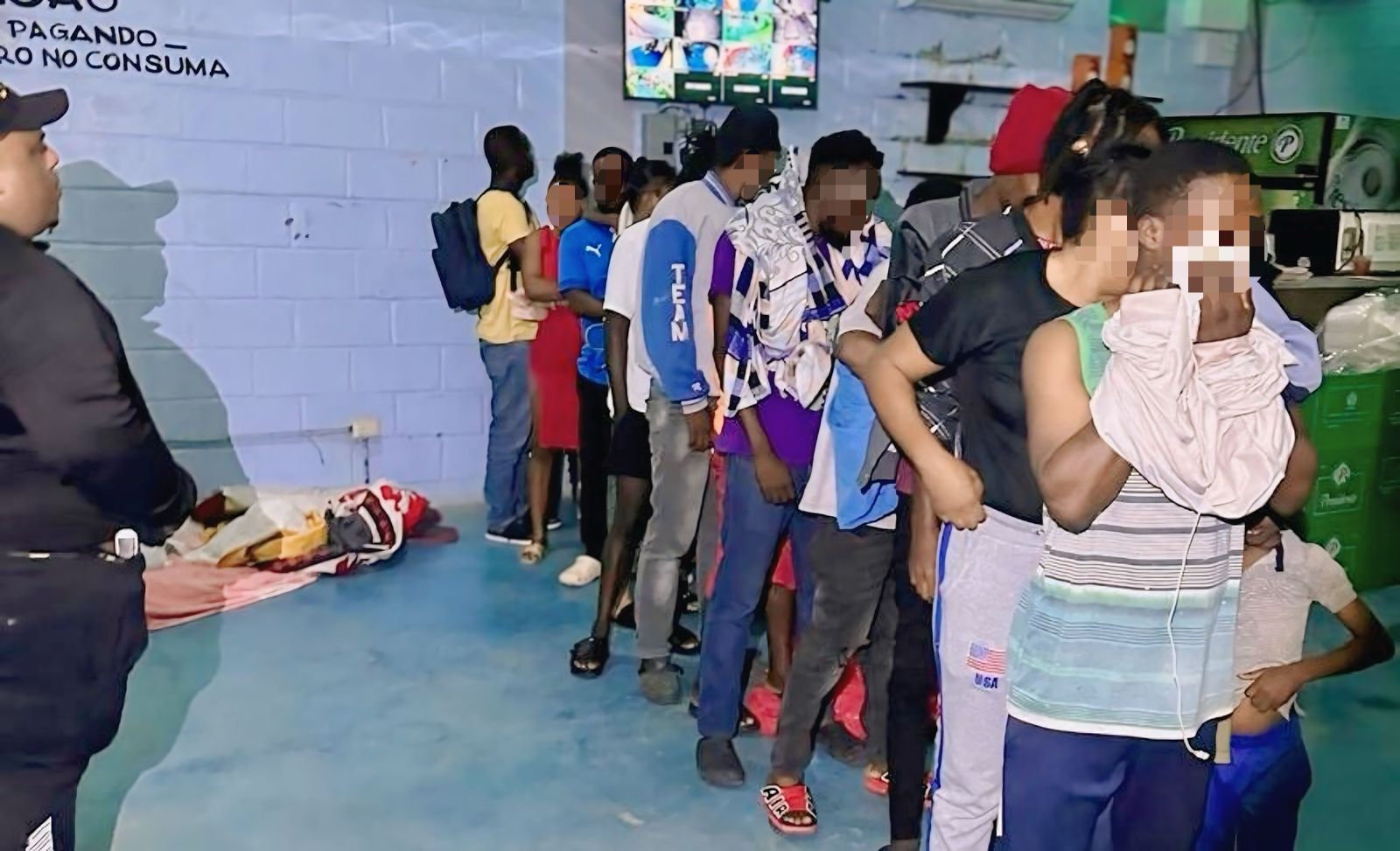 Undocumented foreigners being taken to a detention center and inspected by immigration agents